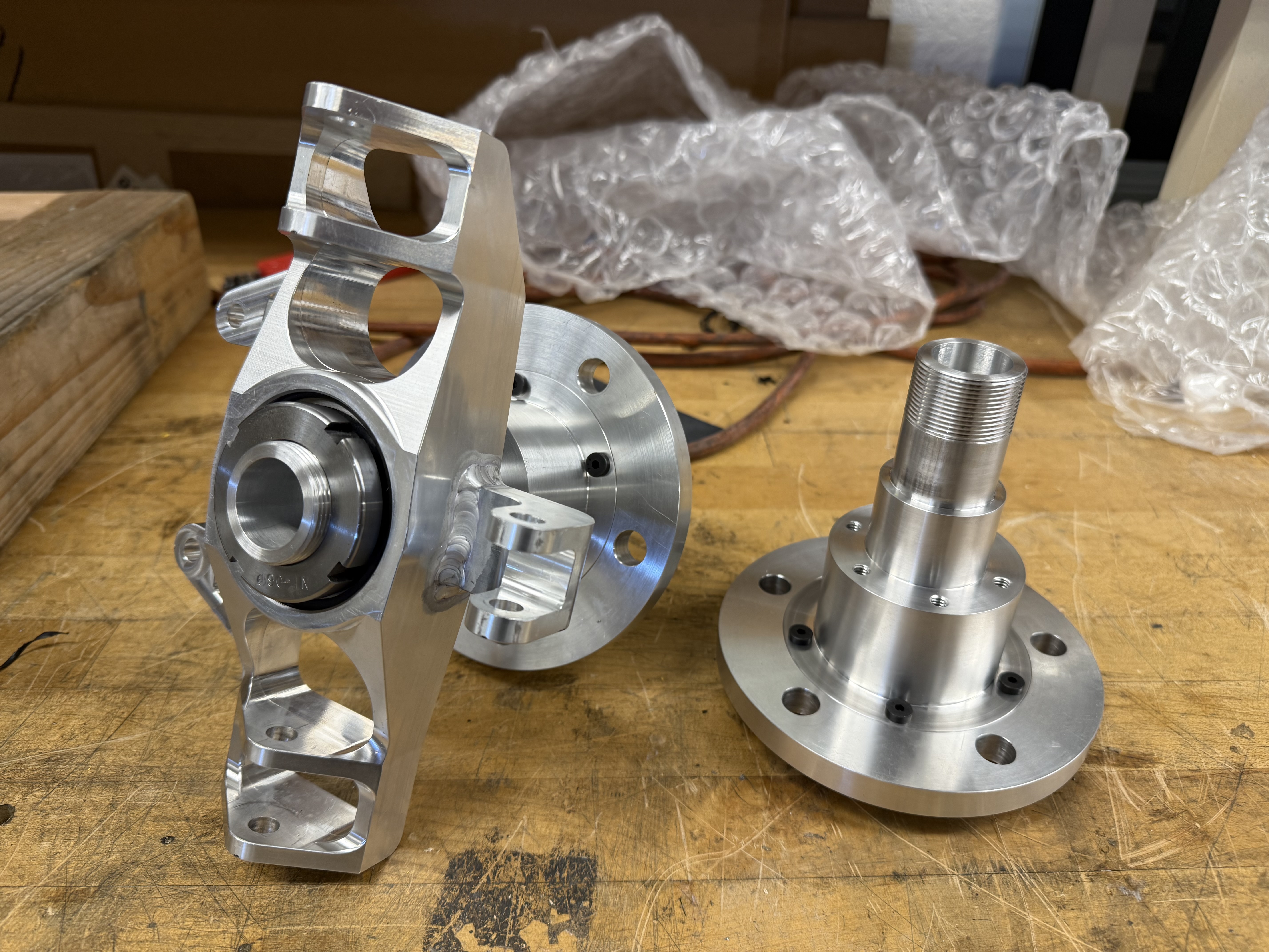 Freshly machined upright, spindle, and wheel hub, interfacing as intended